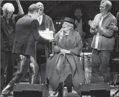  ?? AP PHOTO ?? Joni Mitchell is presented with a birthday cake on stage at JONI 75: A Birthday Celebratio­n on Wednesday, Nov. 7, in Los Angeles.