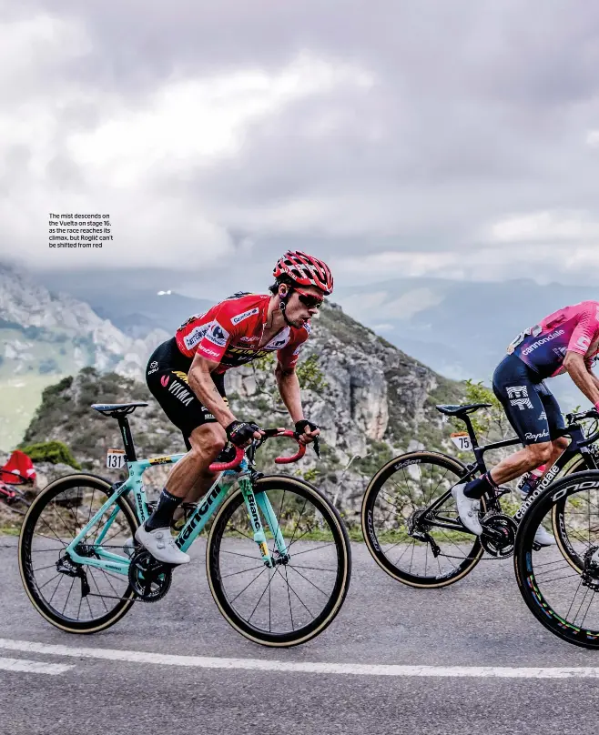  ??  ?? The mist descends on the Vuelta on stage 16, as the race reaches its climax, but Roglič can’t be shifted from red