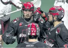  ?? GERRY KAHRMANN/POSTMEDIA NETWORK ?? St. Catharines native and Vancouver Stealth forward Corey Small celebrates a goal with teammates James Rahe and Jordan Durston against the Colorado Mammoth, the Stealth's opponent in the National Lacrosse League West Division final tonight in Langley,...