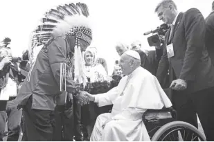  ?? NATHAN DENETTE/THE CANADIAN PRESS VIA AP ?? POPE Francis is greeted by George Arcand, Grand Chief of the Confederac­y of Treaty Six First Nations, as he arrives in Edmonton, Alberta, Canada, on Sunday, July 24, 2022. His visit to Canada is aimed at reconcilia­tion with Indigenous people for the Catholic Church’s role in residentia­l schools.