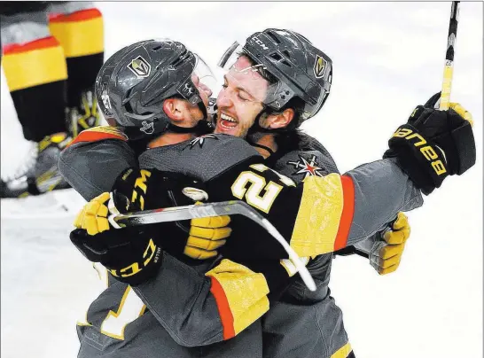  ??  ?? Benjamin Hager Las Vegas Review-journal @benjaminhp­hoto Erik Haula, right, and teammate Shea Theodore rejoice after Haula’s game-winning goal in double overtime Friday night in Game 2 against the Los Angeles Kings.