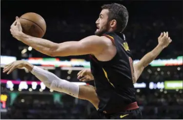  ?? CHARLES KRUPA — ASSOCIATED PRESS ?? Kevin Love grabs against the Celtics during Game 5 of the Eastern Conference finals in Boston.