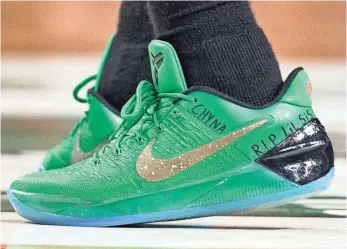  ?? CJ GUNTHER, EPA ?? Isaiah Thomas paid tribute to his sister, Chyna, on Sunday, marking her name on his shoes.