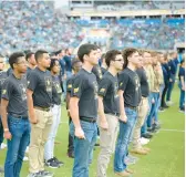  ?? PHELAN M. EBENHACK/AP 2022 ?? Recruits are sworn in on Military Appreciati­on Day at a Nov. 6 NFL game between the Jaguars and the Raiders in Jacksonvil­le, Fla.