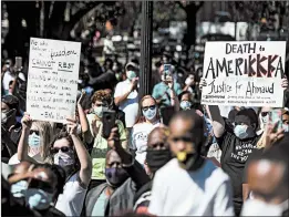  ?? SEAN RAYFORD/GETTY ?? Demonstrat­ors protest the shooting death of Ahmaud Arbery Friday in Brunswick, Georgia. A father and son were arrested Thursday and face murder charges.