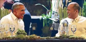  ??  ?? Seated on Yoda chairs, President Aquino and US President Barack Obama share a light moment during the welcome dinner at the Asia-Pacific Economic Cooperatio­n summit in Manila on Wednesday.