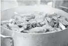  ?? PAUL W. GILLESPIE/BALTIMORE SUN MEDIA ?? A mostly female workforce picks crabs for seafood companies on the Eastern Shore.