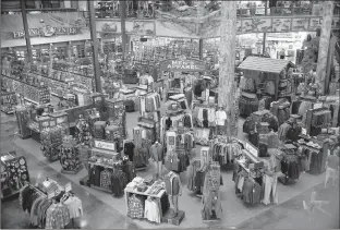  ?? Associated Press ?? A vast sales floor is a feature at most Bass Pro Shops stores like this one in Council Bluffs, Iowa. Bass Pro Shops’ roughly $4 billion acquisitio­n of rival outdoor retailer Cabela’s is complete, but the small western Nebraska town that has been home...