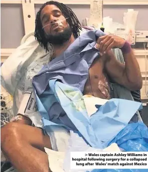  ??  ?? > Wales captain Ashley Williams in hospital following surgery for a collapsed lung after Wales’ match against Mexico