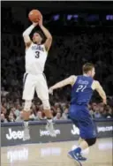  ?? FRANK FRANKLIN II — THE ASSOCIATED PRESS ?? Villanova’s Josh Hart (3) shoots over Creighton’s Isaiah Zierden (21) during the first half Saturday in the finals of the Big East Tournament in New York.
