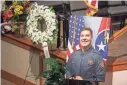  ?? BRIANNA PACIORKA/NEWS SENTINEL ?? Photos of fallen Knox County Sheriff’s deputy Tucker Blakely and flowers are displayed during a service for Blakely at Clear Springs Baptist Church in Corryton on Oct. 6.