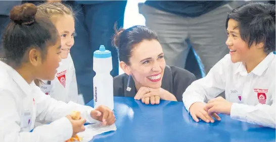  ??  ?? Prime Minister Jacinda Ardern with Sunset Primary pupils Manaia Taramai, 10 (left), Priya Raethel, 9, and Shadik Tonihi, 9.