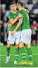  ??  ?? John Egan (l) and Shane Duffy embrace after the game