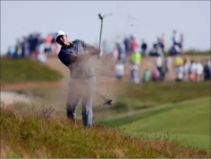  ?? FRANK FRANKLIN II — THE ASSOCIATED PRESS ?? Brooks Koepka hits an approach shot on the 12th hole during the final round of the U.S. Open Sunday in Southampto­n, N.Y.