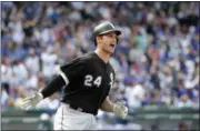  ?? CHARLES REX ARBOGAST — THE ASSOCIATED PRESS ?? Chicago White Sox’s Matt Davidson celebrates down the first base line his home run off Chicago Cubs relief pitcher Koji Uehara during the eighth inning of a baseball game Monday in Chicago.