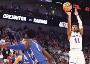  ?? Tom Pennington / Getty Images ?? Kansas’ Remy Martin (11) shoots against Creighton during the second round of the NCAA Men’s Basketball Tournament at Dickies Arena on Saturday in Fort Worth, Texas.