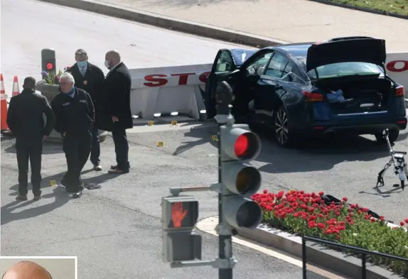  ?? Getty imAgeS ?? MASSACHUSE­TTS MAN MOURNED: Investigat­ors work at the scene where a car charged a barricade Friday at the Capitol, ramming police officers. One officer was killed along with the driver. The officer killed was identified as William ‘Billy’ Evans, left, an 18-year veteran of the Capitol Police and a native of North Adams.