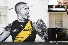  ?? Photograph: James Ross/ AAP ?? A mural of Tigers star Dustin Martin in Richmond, Melbourne.