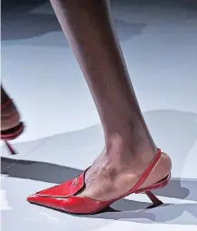  ?? ?? PRADA’S micro heels were a hot topic at Milan Fashion Week. Kitten heels are great for elevating an outfit, without too much distractio­n.