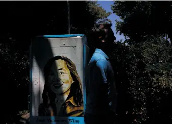  ?? Leah Millis / The Chronicle 2017 ?? The Arts and Humanities Academy’s class of 2012 honored Jean Yonemura Wing, whose image is shown on a decorated utility box in 2017. The academy is located at Berkeley High School.