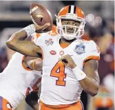  ?? CHRIS O’MEARA/ASSOCIATED PRESS ?? Clemson QB DeShaun Watson accounted for five TDs as the Tigers beat Virginia Tech in a shootout for the ACC crown.