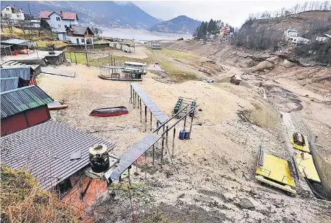  ??  ?? A picture taken on Feb 7 shows stranded rafts and pontoons near the shores of the Jablanicko artificial lake near the Bosnian town of Konjic.— AFP photo