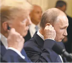  ?? BRENDAN SMIALOWSKI, AFP/GETTY IMAGES ?? President Donald Trump and his Russian counterpar­t, Vladimir Putin, met in Helsinki this week, and some critics suggest that Trump’s support of Putin bordered on treason.