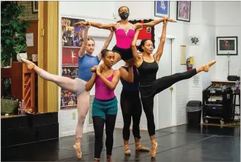  ?? PHOTOS BY BITA HONARVAR FOR THE AJC ?? Brooke Geffrey-bowler (from left), Karla Tyson, Laila Howard and Charizma Lawrence (partially hidden) lift Njema Williams during the Ballethnic Dance Company’s rehearsal of the ballet “Sanctity” at their studio in East Point ahead of a performanc­e at the Alliance Theatre this weekend.