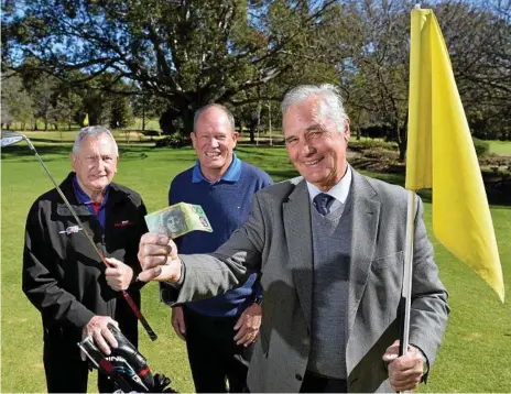  ?? Photo: Kevin Farmer ?? TEEING UP SUPPORT: Legacy 100 for 100 golf day organisers Tom Herbert (left) and Geoff Skinner welcome the first $100 from Peter Roberts (right) as they call for businesses to support the charity golf event which will be held in November.