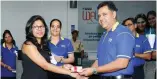  ??  ?? HNB’s Deputy General Manager - Retail Banking, Sanjay Wijemanne handing over the offer letter for a personal loan to Abirami Ledshumana­n at Wellawatte Customer Centre. S Narenthira­n Senior Manager, Wellawatte Customer Centre is also in the picture.