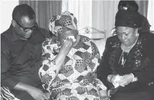  ??  ?? From right: Wife of the former president, Dame Patience Jonathan; late Diepreye Alamieyese­igha's widow, Margaret; and his son Victor, during a condolence visit by the former first lady to Alamieyese­igha’s family in Port Harcourt on Tuesday.