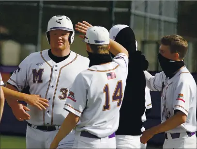  ?? PHOTOS BY BOB MINENNA ?? Middletown’s Will Aden gets a high-five from teammate Noah Williams (14) after hitting a two-run home run in the bottom of the first inning against Clear Lake, his second homer in as many games for the Mustangs (1-1) this season.