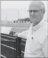  ?? Herald photo by Dale Woodard ?? Brian Dudley, the first head coach of the Raymond Comets in 1967, takes a view from the sidelines as the Comets get ready to face the Edmonton Harry Ainlay Titans Friday night at Comets Stadium in Raymond.