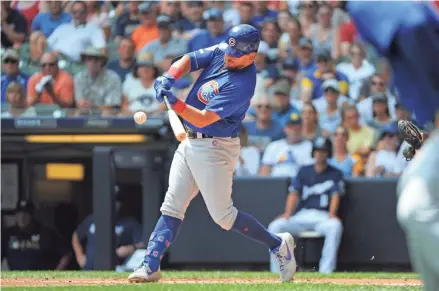  ?? MICHAEL MCLOONE / USA TODAY SPORTS ?? The Cubs' Kyle Schwarber connects on a grand slam in the second inning.