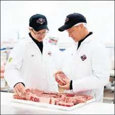  ?? JERRY DAVICH/POST-TRIBUNE ?? Zac Linz, 27, and his father, Fred Linz, 52, work together in their four-generation family business, Meats by Linz, Inc., which operates a processing plant in Calumet City.