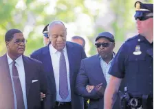  ?? MATT ROURKE/ASSOCIATED PRESS ?? Bill Cosby arrives at Montgomery County Courthouse in Norristown, Pa., with comedian Joe Torry, second from right, for his sexual assault trial Friday.