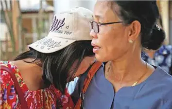  ?? Reuters ?? Survivors wait to get aid from the government at Pathein General Hospital after the boat capsized.