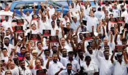  ??  ?? Taxi Drivers displaying solidarity outside the Jalan Duta court complex, yesterday.