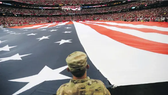  ?? DAVID GOLDMAN/THE ASSOCIATED PRESS/FILES ?? “Our military men and women have been traditiona­lly among our most ardent fans,” says NFL spokesman Joe Browne, who retired in 2016.