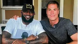  ??  ?? LeBron James and Klutch Sports Group general manager Rob Pelinka are all smiles after inking a deal with the LA Lakers