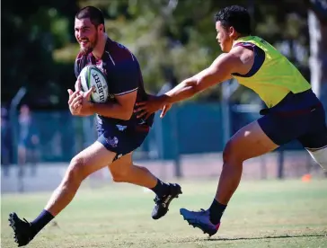  ?? (AFP) ?? Queensland Reds captain Liam Wright (left) training in Brisbane yesterday.