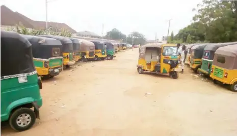  ??  ?? A tricycle riders park on Gongola road Barnawa in front of OPAY office.