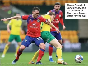  ??  ?? Kieran Dowell of Norwich City and Corry Evans of Blackburn Rovers battle for the ball.