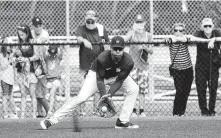  ??  ?? Astros first baseman Yuli Gurriel fields a ground ball during the workout Monday at the Ballpark of the Palm Beaches.