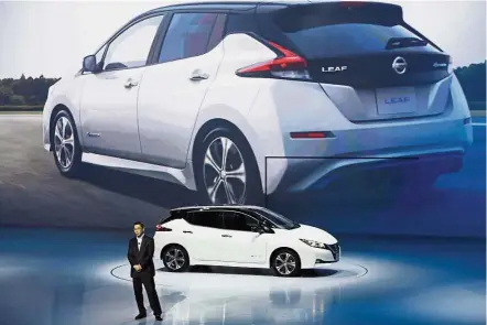  ?? — AP ?? Stiff competitio­n: Hiroto unveils the new Leaf electric vehicle during the world premiere in Chiba yesterday. The launch comes after luxury electric car maker Tesla made its first foray into the Leaf’s more affordable price band in July with its...