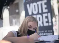  ?? ANDA CHU – STAFF PHOTOGRAPH­ER ?? Nicole Brunker prepares to vote on the recall election with a provisiona­l ballot at a polling place located at the UC Berkeley student union in Berkeley on Tuesday.