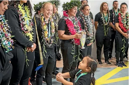  ?? PHOTO: LAWRENCE SMITH/STUFF ?? A young fan gets in on the celebratio­ns as the Black Ferns returned to New Zealand yesterday.