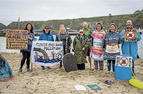  ?? ?? BEACH PROTEST: Swimmers make their point at the family-friendly peaceful gathering held at Stonehaven Harbour. Pictures by Wullie Marr.