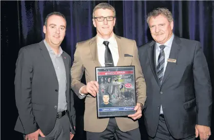  ?? PHIL MATUSIEWIC­Z/SPORT P.E.I. ?? Freetown native Steve Reeves won the masters athlete of the year award at the recent Sport P.E.I. awards night. From left are Jamie MacPhail of Amalgamate­d Dairies Ltd., Reeves and Sport P.E.I. board member Ron Waite.