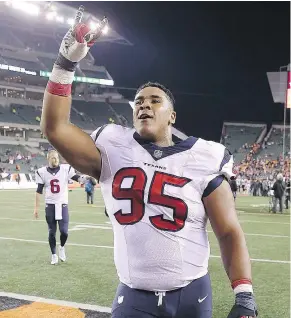  ?? — GETTY IMAGES FILES ?? Christian Covington acknowledg­es the crowd while walking off the field after an NFL game.